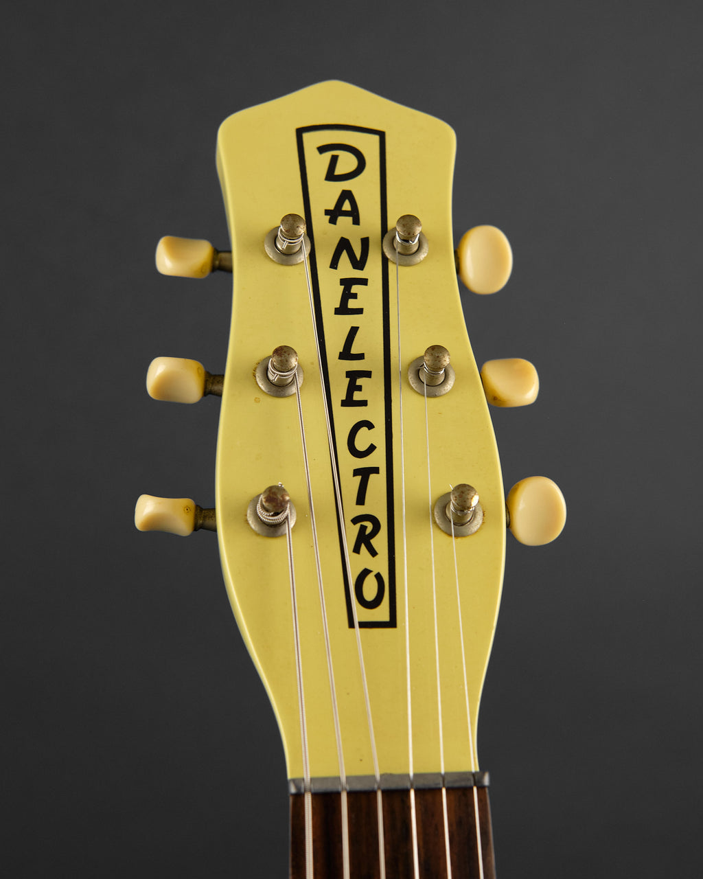 1990s Danelectro DC-59 Daddy-O Yellow - headstock front | Replay Guitars
